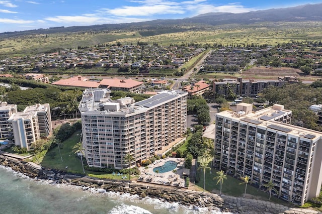 birds eye view of property featuring a mountain view