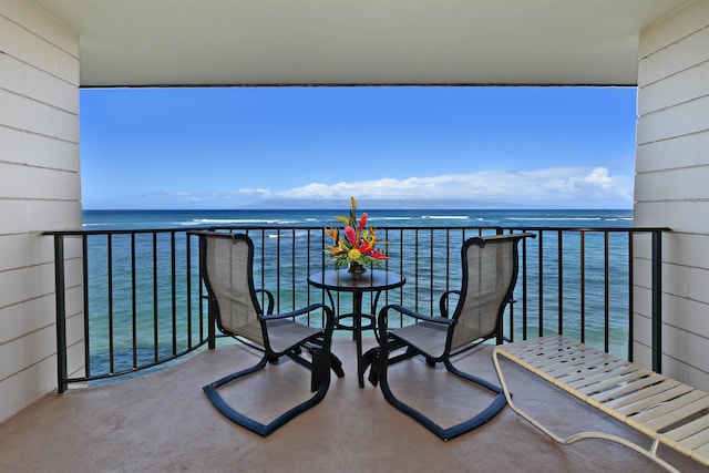 balcony featuring a water view