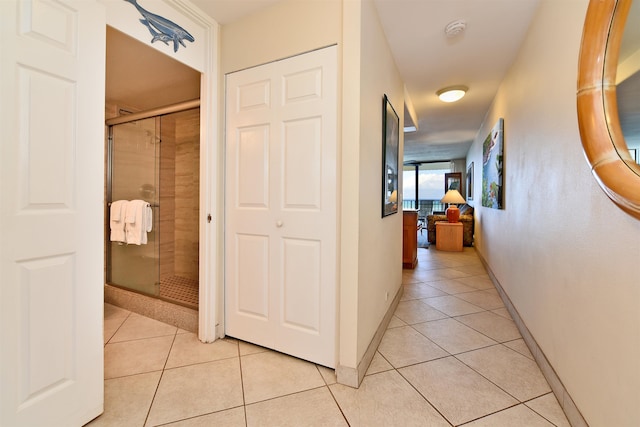 hallway featuring light tile floors