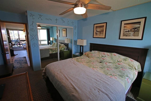 bedroom with ceiling fan and a closet