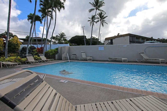 view of swimming pool with a patio