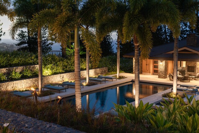 view of pool with a patio area and an outbuilding