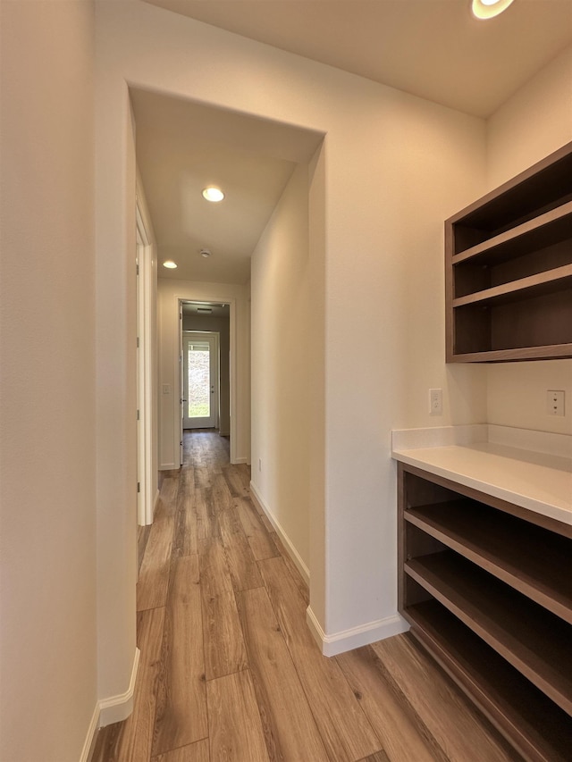 hall with light wood-type flooring