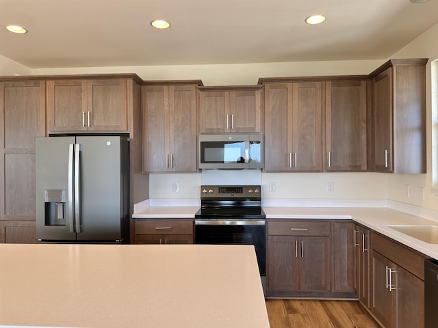 kitchen featuring light wood-type flooring and stainless steel appliances