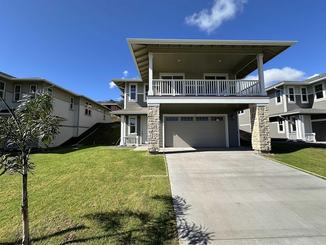 view of front of house featuring a balcony, a garage, and a front lawn