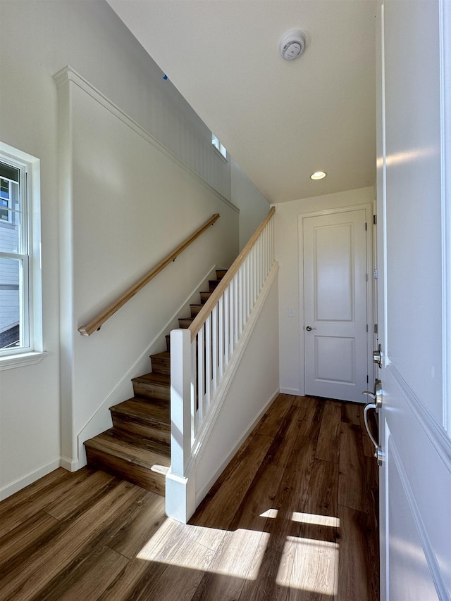 staircase featuring hardwood / wood-style flooring