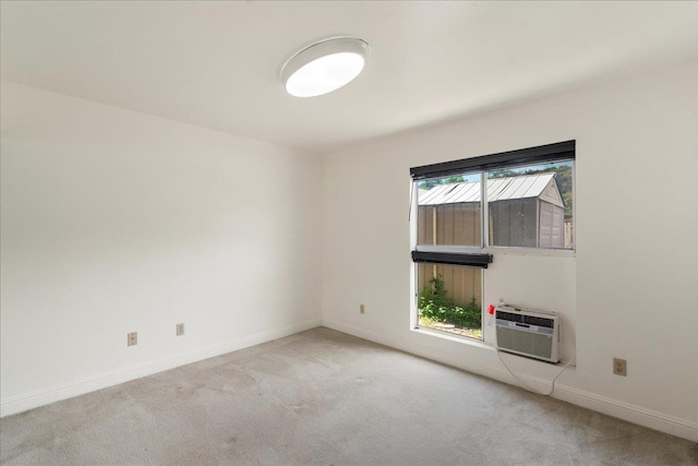 80 Waiaka Ln Unit 37-103, Wailuku, HI 96793 - unfurnished room featuring light colored carpet and a wall mounted air conditioner