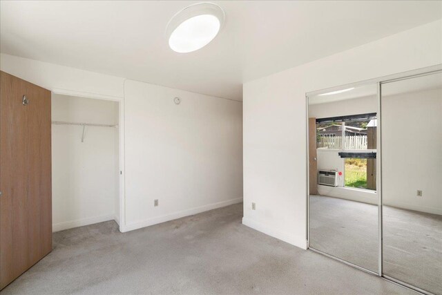 80 Waiaka Ln Unit 37-103, Wailuku, HI 96793 - unfurnished bedroom featuring carpet floors and cooling unit