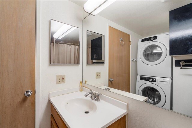 80 Waiaka Ln Unit 37-103, Wailuku, HI 96793 - bathroom with stacked washing machine and dryer and vanity