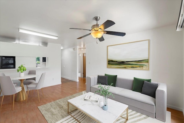 80 Waiaka Ln Unit 37-103, Wailuku, HI 96793 - living room with wood finished floors and ceiling fan