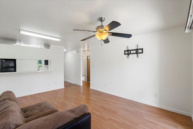 80 Waiaka Ln Unit 37-103, Wailuku, HI 96793 - living area with light wood-style floors and ceiling fan