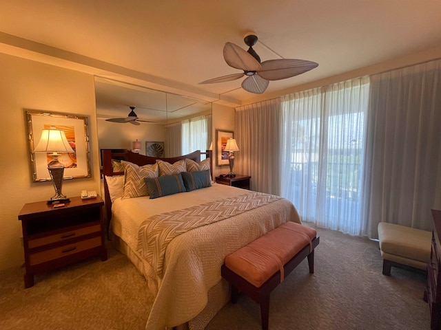 bedroom with ceiling fan and carpet floors