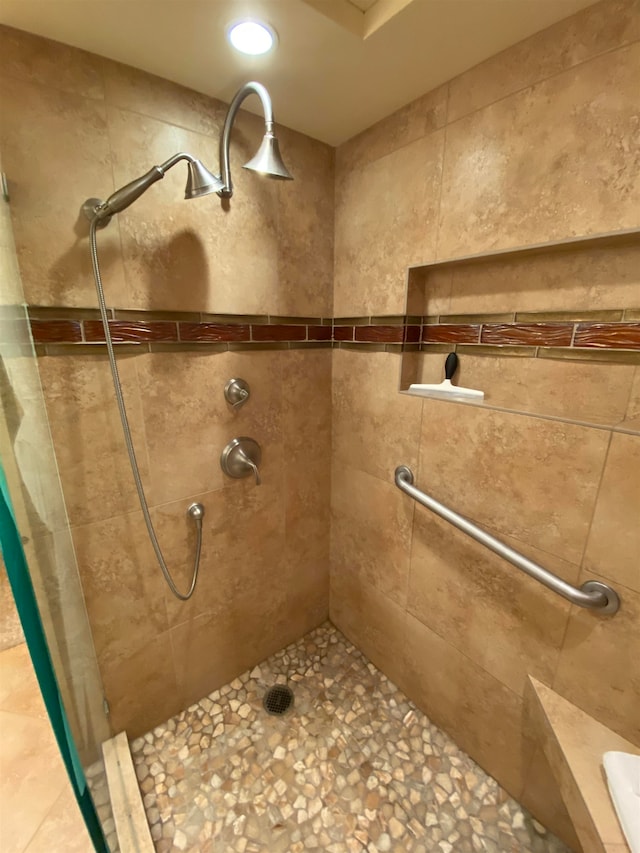 bathroom with tiled shower