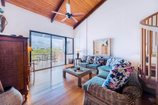living area featuring high vaulted ceiling, a ceiling fan, wood finished floors, wood ceiling, and beamed ceiling