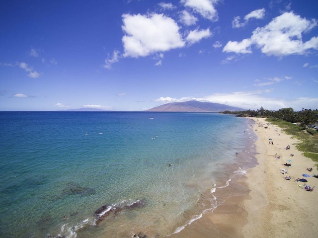 view of water feature with a view of the beach and a mountain view