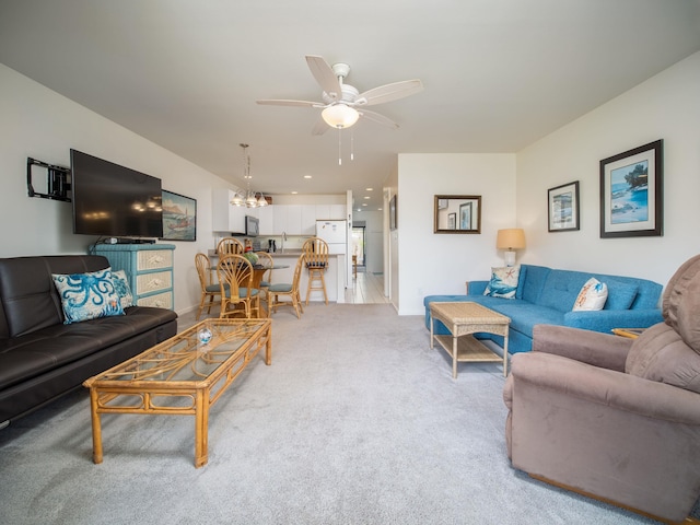 2777 S Kihei Rd Unit K-101, Kihei, HI 96753 - living room with a ceiling fan, light colored carpet, and a chandelier