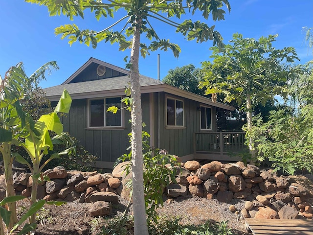 view of property exterior with a deck