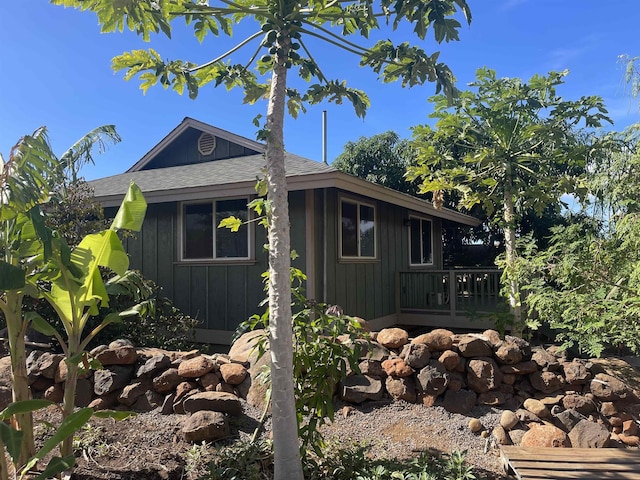 view of home's exterior with a wooden deck