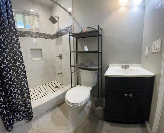 bathroom with a shower with curtain, vanity, and toilet