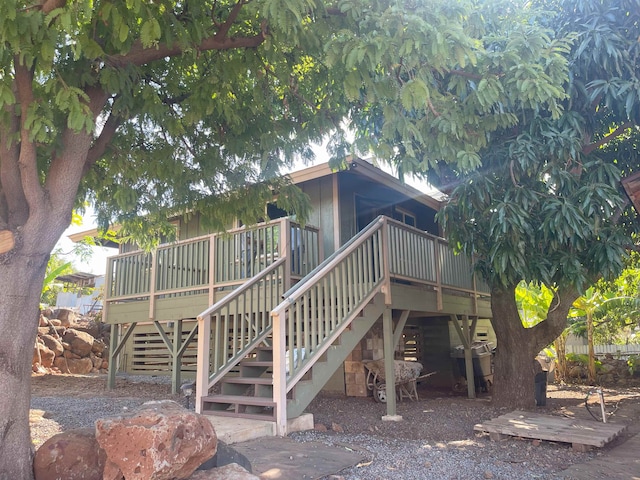 back of house with a wooden deck