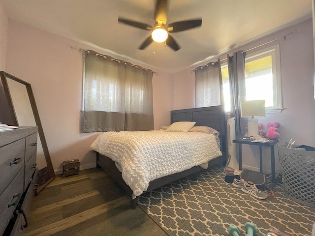 bedroom featuring dark hardwood / wood-style floors and ceiling fan