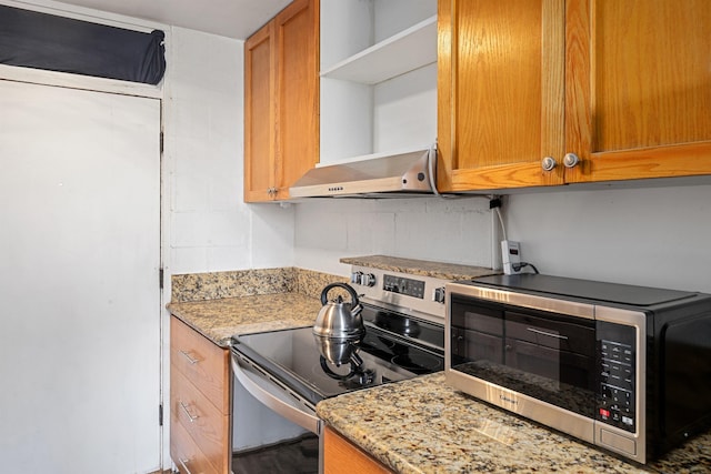 3660 Lower Honoapiilani Rd Unit 306, Lahaina, HI 96761 - kitchen with appliances with stainless steel finishes, open shelves, wall chimney exhaust hood, light stone countertops, and brown cabinets
