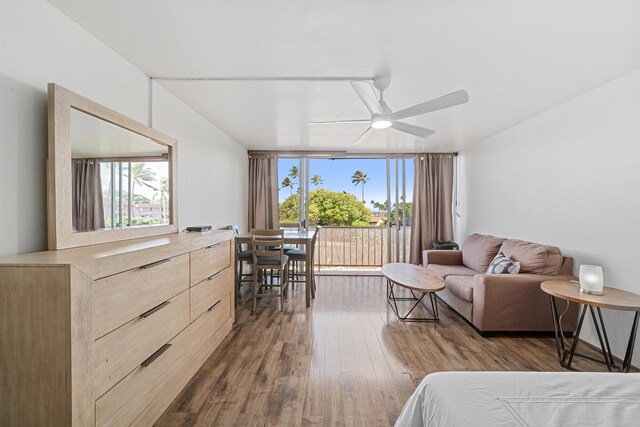 3660 Lower Honoapiilani Rd Unit 306, Lahaina, HI 96761 - bedroom featuring dark wood-style flooring, expansive windows, and a ceiling fan
