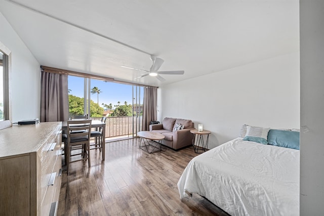 3660 Lower Honoapiilani Rd Unit 306, Lahaina, HI 96761 - bedroom featuring expansive windows, wood finished floors, and ceiling fan