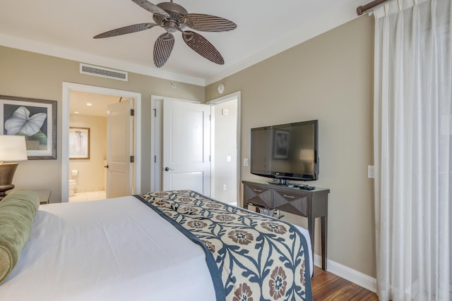 bedroom featuring ceiling fan, wood-type flooring, and ensuite bath