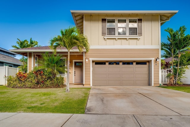 view of front facade featuring a garage and a front lawn