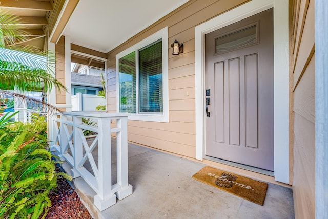 property entrance with covered porch