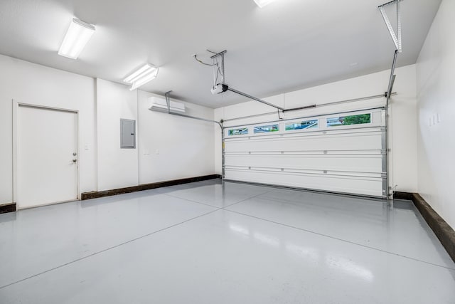 garage featuring a garage door opener and electric panel