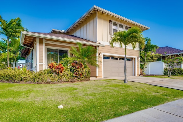 view of front of property with a garage and a front yard