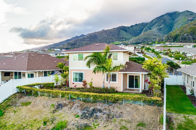 rear view of property featuring a mountain view