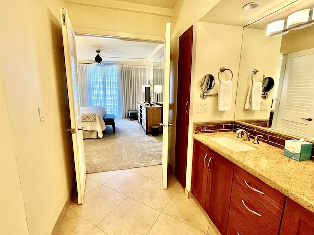 bathroom featuring vanity, tile patterned flooring, and ceiling fan