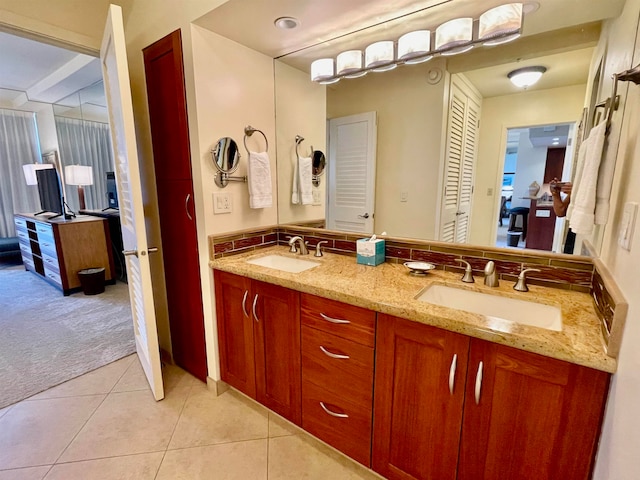 bathroom with vanity and tile patterned flooring