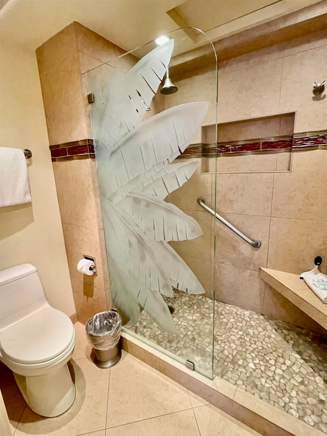 bathroom featuring toilet, walk in shower, and tile patterned floors