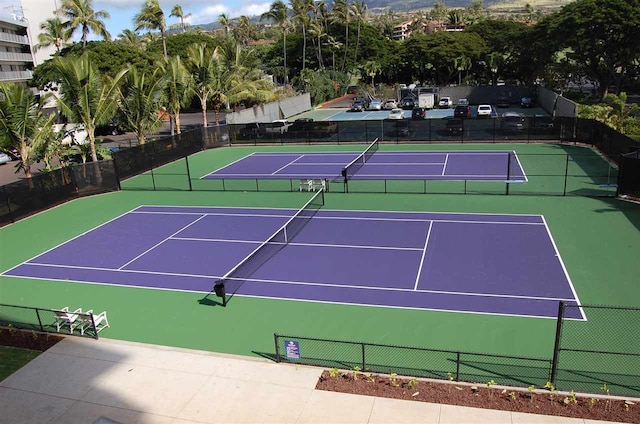 view of tennis court featuring basketball court