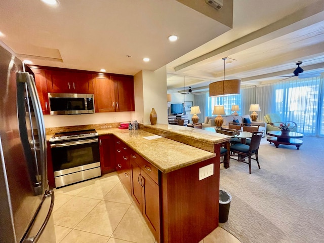 kitchen featuring kitchen peninsula, light stone countertops, light tile patterned flooring, appliances with stainless steel finishes, and ceiling fan