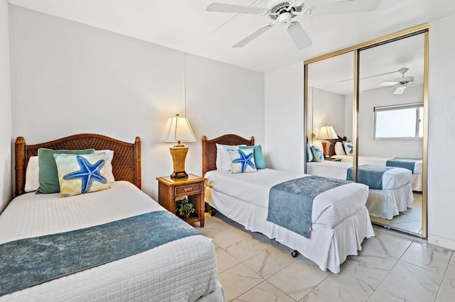 bedroom with ceiling fan and a closet