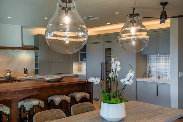 kitchen featuring backsplash and sink