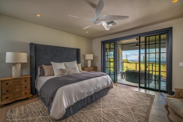 bedroom with hardwood / wood-style flooring, ceiling fan, and access to exterior