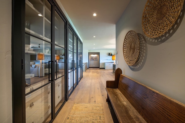 hall with light hardwood / wood-style flooring