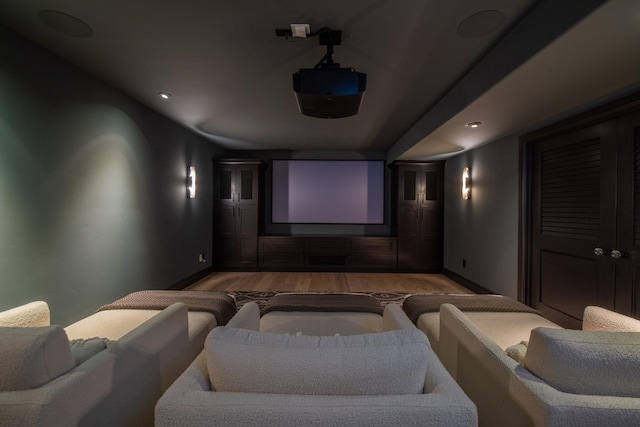 home theater room featuring wood-type flooring