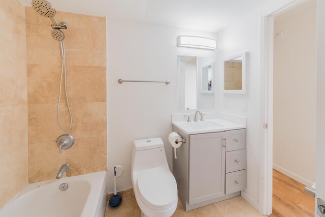 160 Keonekai Rd Unit 9-102, Kihei, HI 96753 - full bathroom featuring tiled shower / bath, hardwood / wood-style floors, vanity, and toilet