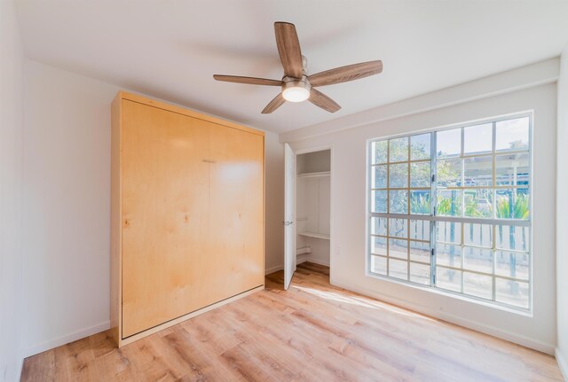 160 Keonekai Rd Unit 9-102, Kihei, HI 96753 - unfurnished bedroom with light hardwood / wood-style flooring and ceiling fan