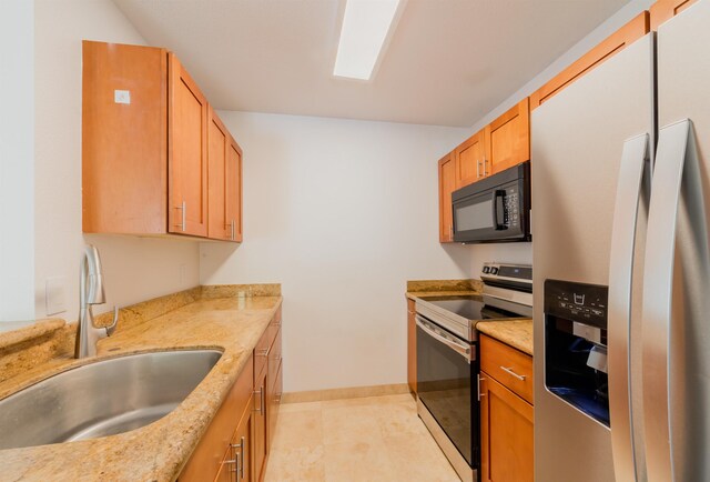 160 Keonekai Rd Unit 9-102, Kihei, HI 96753 - kitchen with light stone counters, sink, and appliances with stainless steel finishes