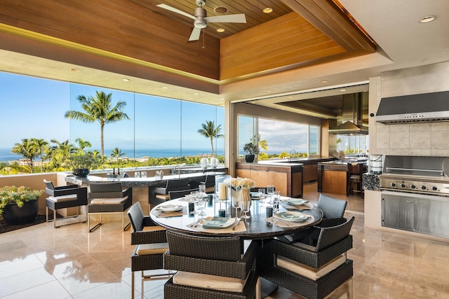 view of patio / terrace with an outdoor kitchen, a ceiling fan, outdoor dining space, a sink, and a grill