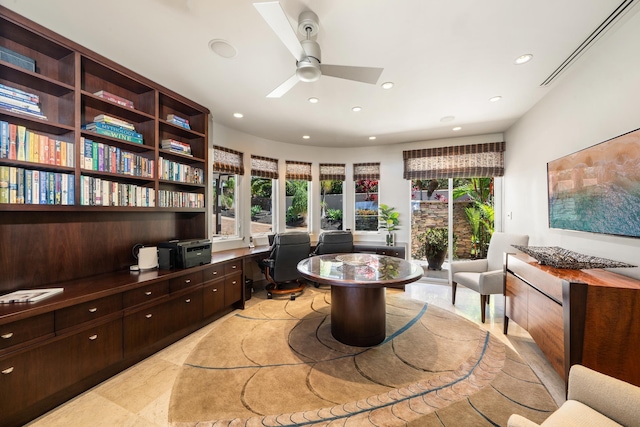 office featuring recessed lighting, ceiling fan, and built in desk