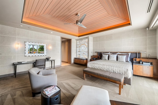 bedroom with wood ceiling and a raised ceiling